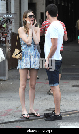 Whitney Port in flip flops and a short blue and white dress, out and about on a hot day with and Ben Nemtin in Manhattan New Stock Photo