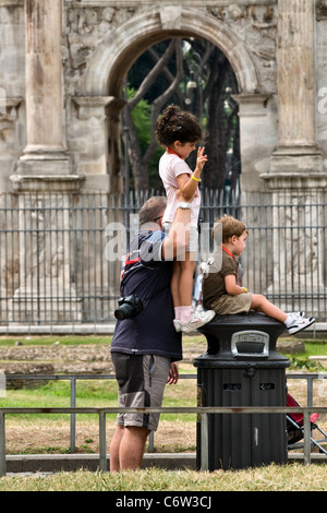 Family on holiday in Rome have their photograph taken Stock Photo