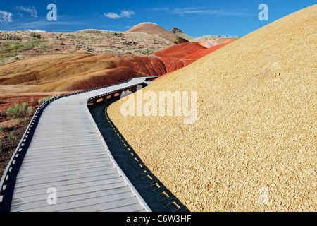 A boardwalk leads through the ash deposits along the Painted Cove Trail in Oregon’s John Day Fossil Beds National Monument. Stock Photo