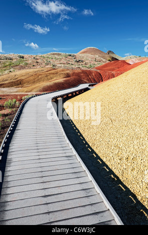 A boardwalk leads through the ash deposits along the Painted Cove Trail in Oregon’s John Day Fossil Beds National Monument. Stock Photo