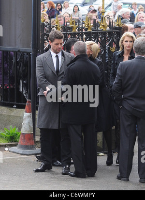 Keith Duffy, Lisa Duffy, Yvonne Keating The funeral of RTE broadcaster Gerry Ryan at the Church of St. John the Baptist, Stock Photo