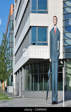 Sculpture The Long Banker / Langer Baenker in front of the Deka Bank at the  Kirchberg plateau, Luxembourg Stock Photo
