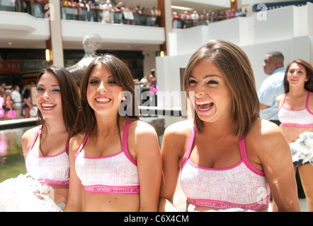Cheerleaders await their results from the judges at the 2010 Miami Dolphins Final Cheerleader Auditions at Aventura Mall in Stock Photo