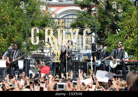 Kevin Jonas, Nick Jonas and Joe Jonas Jonas Brothers performing live on stage at The Grove Los Angeles, California, USA - Stock Photo