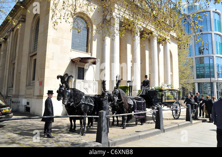 A horse drawn carriage carries the coffin containing the body of the late Malcolm McLaren who died of mesothelioma on April Stock Photo