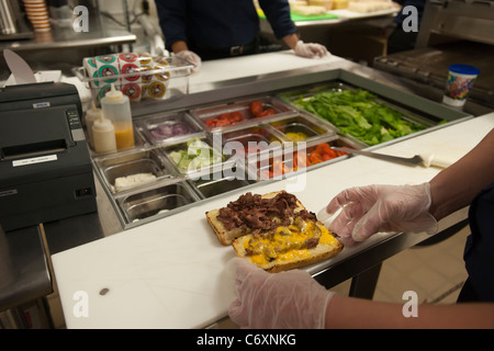 Workers prepare sandwiches at the Earl of Sandwich opening of their first shop in New York Stock Photo