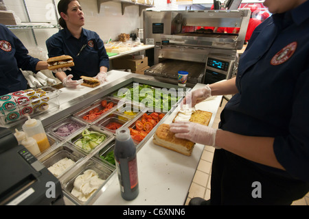 Workers prepare sandwiches at the Earl of Sandwich opening of their first shop in New York Stock Photo