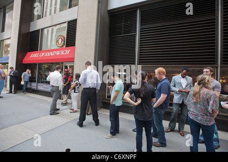 A line of customers outside The Earl of Sandwich at the opening of their first shop in New York Stock Photo