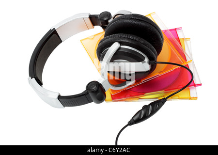 Stereo headphone and compact disks in colorful plastic cases on white background Stock Photo