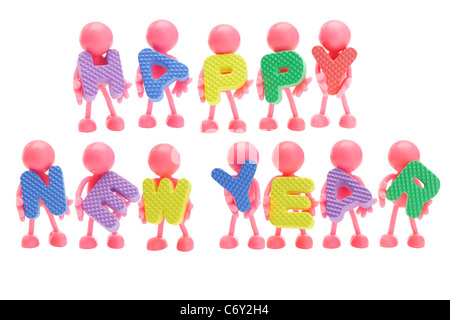 Faceless rubber figurines and Happy New Year letter blocks on white background Stock Photo