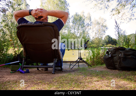 fisherman on the riverbank waiting for a catch Stock Photo