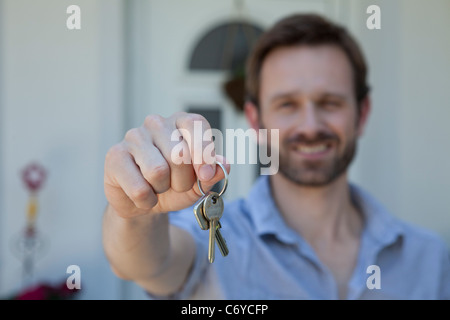 Man offering set of keys Stock Photo