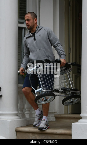 Joe Cole The England and Chelsea Football player Joe Cole with wife Carly Zucker and their newly born baby girl leaving home. Stock Photo