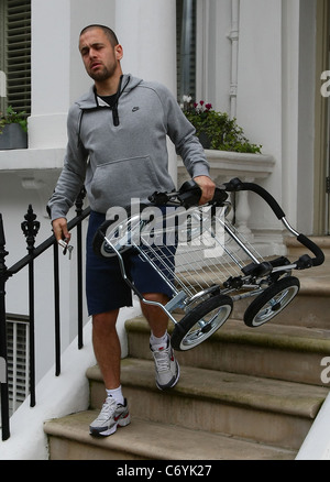 Joe Cole The England and Chelsea Football player Joe Cole with wife Carly Zucker and their newly born baby girl leaving home. Stock Photo