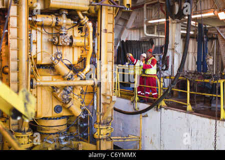 Workers on oil rig Stock Photo