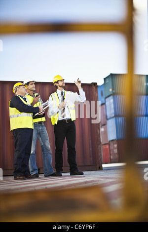 Workers talking in shipping yard