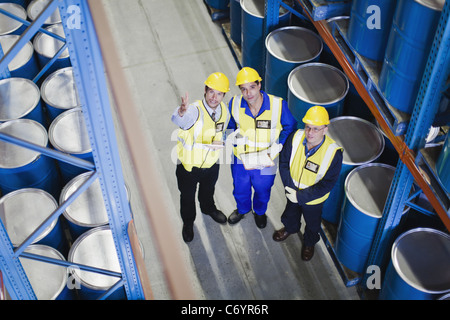 Workers with clipboards in warehouse Stock Photo