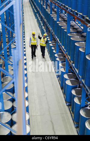 Workers talking in warehouse Stock Photo