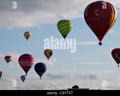 dh Bristol Balloon Fiesta CLIFTON BRISTOL Balloon festival hot air balloons flying above Clifton Suspension bridge uk Stock Photo