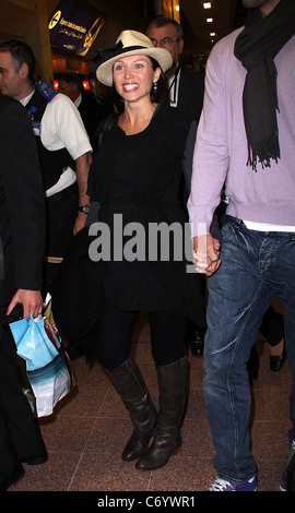 Dannii Minogue and her partner Kris Smith arrive at Heathrow Airport London, England - 12.04.10 Stock Photo