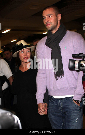 Dannii Minogue and her partner Kris Smith arrive at Heathrow Airport London, England - 12.04.10 Stock Photo