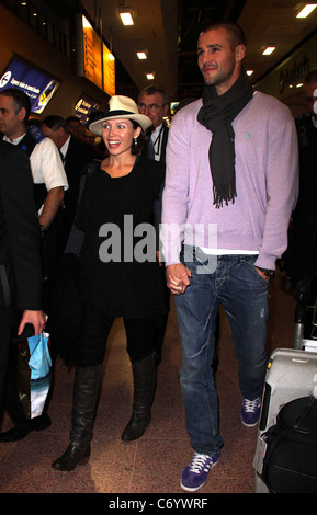 Dannii Minogue and her partner Kris Smith arrive at Heathrow Airport London, England - 12.04.10 Stock Photo