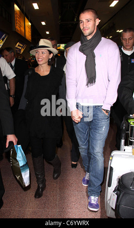 Dannii Minogue and her partner Kris Smith arrive at Heathrow Airport London, England - 12.04.10 Stock Photo