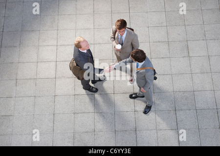 Business people talking in courtyard Stock Photo