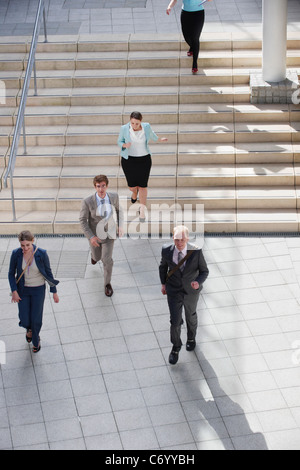 Business people walking in courtyard Stock Photo