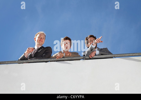 Businessmen standing on walkway Stock Photo
