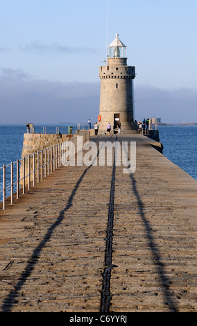 The end of the breakwater that protects  the harbour at St Peter Port. St Peter Port, Guernsey, Channel Islands, UK. Stock Photo