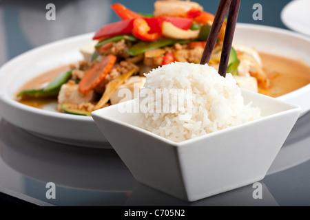 Fresh Thai food stir fry with tofu and white jasmine rice. Stock Photo