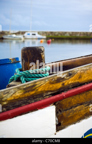 Rope wrapped around wooden dock post Stock Photo