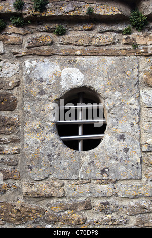 Barred Window on The Old Village Lock Up or Gaol at Buckland Dinham Stock Photo