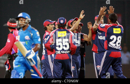 Delhi Daredevils player MF Maharoof celebrates with teammates after taking the wicket of Mumbai Indian player Sanath Jayasuriya Stock Photo