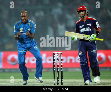 Mumbai Indian players Sanath Jayasuriya celebrates after taking the wicket of Delhi Daredevils player Mithun Manhas during the Stock Photo