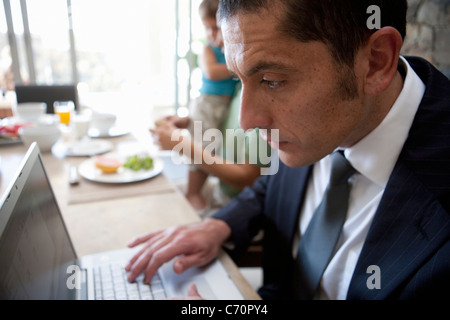 Close up of businessman using laptop Stock Photo