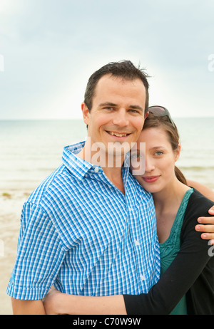 Couple hugging on beach Stock Photo