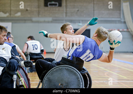 Men in wheelchairs playing pararugby Stock Photo