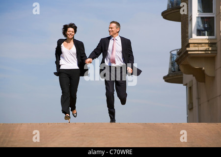 Business people running on street Stock Photo