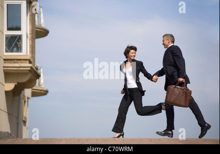 Business people running on street Stock Photo