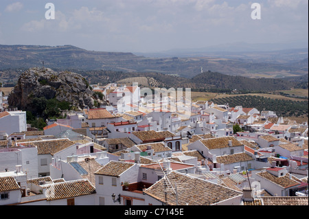 OLVERA TYPICAL SPANISH WHITE VILLAGE VIEW SPAIN ANDALUCIA WITH A ROCK AND OLIVE TREE GROVES IN THE COUNTRYSIDE Stock Photo