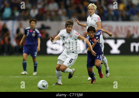Amy LePeilbet of the United States (6) battles with Shinobu Ohno of Japan (11) during the 2011 FIFA Women's World Cup final. Stock Photo