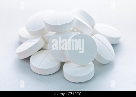 Calcium supplement pills in a pile closeup Stock Photo