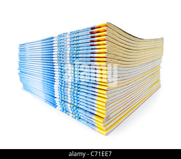 Many magazines stacked in a pile isolated on white Stock Photo