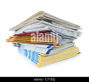 Printed paper publications stacked in a pile isolated on white Stock Photo
