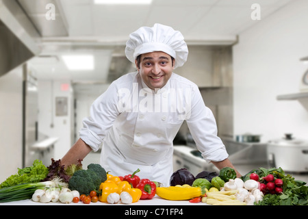 Portrait of a chef with his vegetables Stock Photo