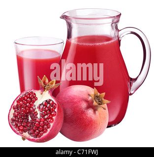 Pomegranate juice in pitcher and pomegranates. Isolated on white background Stock Photo