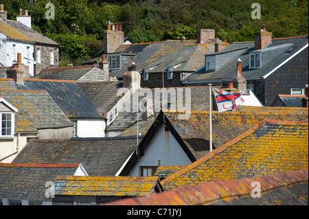 Looking across the rooftops of houses in the pretty Cornish fishing village of Port Isaac, Cornwall, England. Stock Photo