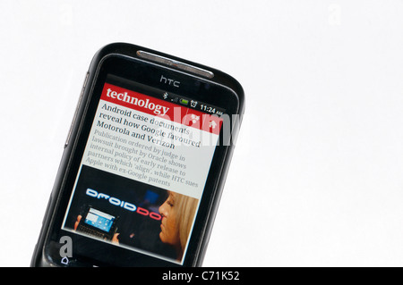 A news item about Android devices displayed on an HTC Android mobile 'phone. Stock Photo